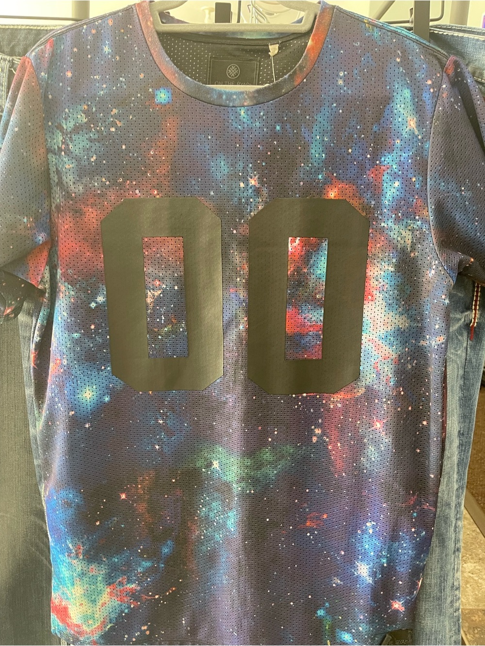 on the byas Galaxy Mesh Tee in Blue, Purple & Red with Black '00'